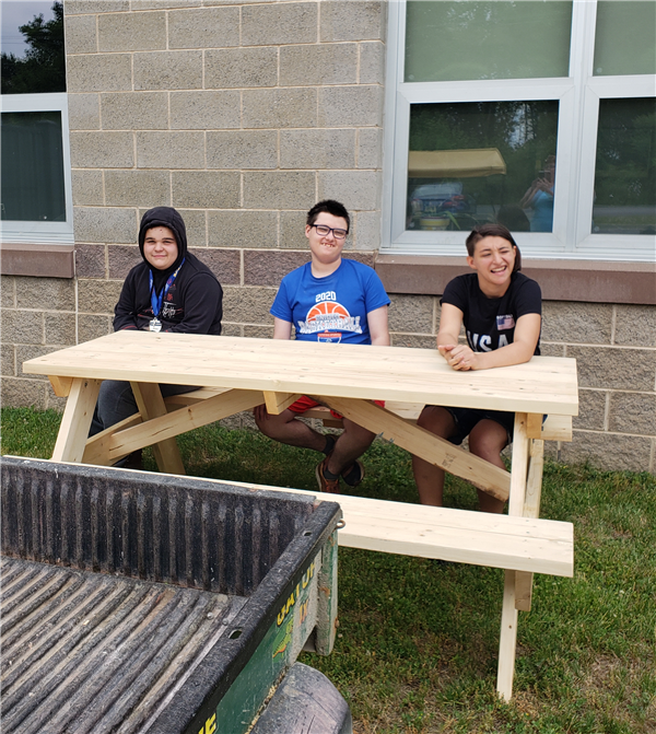 Life Skills students sitting on a picnic table
